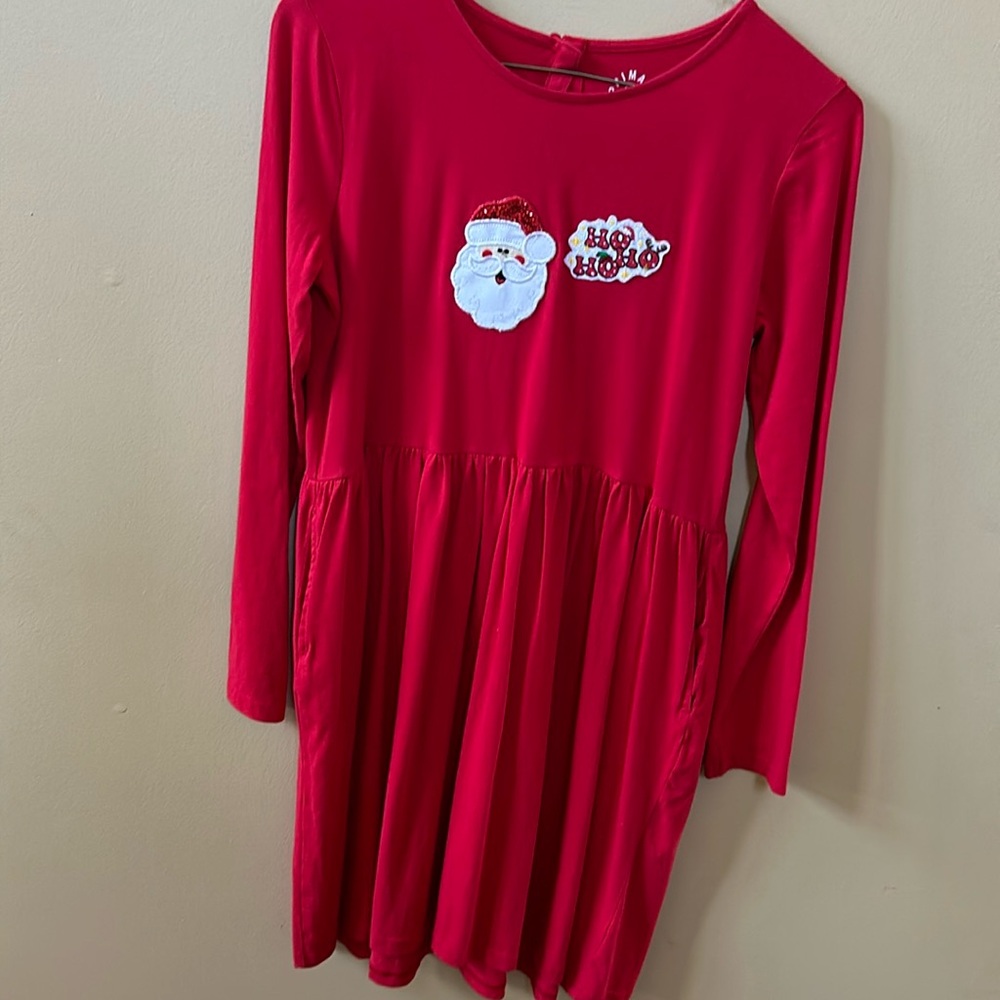 NWOT red Primary pocket dress size 14. Santa and Ho Ho Ho patches sewn on.